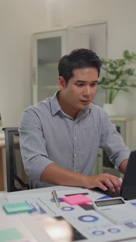 Professional businessman experiencing intense work-related emotions while analyzing financial documents on laptop. Transitioning through deep concentration. Growing frustration