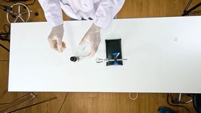 Scientist conducts a chemical reaction using lead nitrate and potassium iodide on a laboratory table - Powered by Shutterstock - Get 15% off with code: PIKWIZARD15