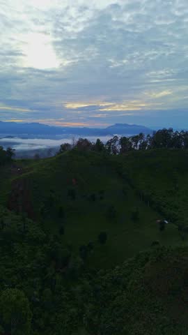 Scenic View of Mountains and Clouds at Dusk
