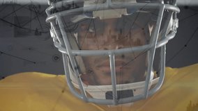 American football player wearing helmet with data processing animation overlay. Athlete, sports, technology, innovation, analytics, gridiron - Powered by Shutterstock - Get 15% off with code: PIKWIZARD15
