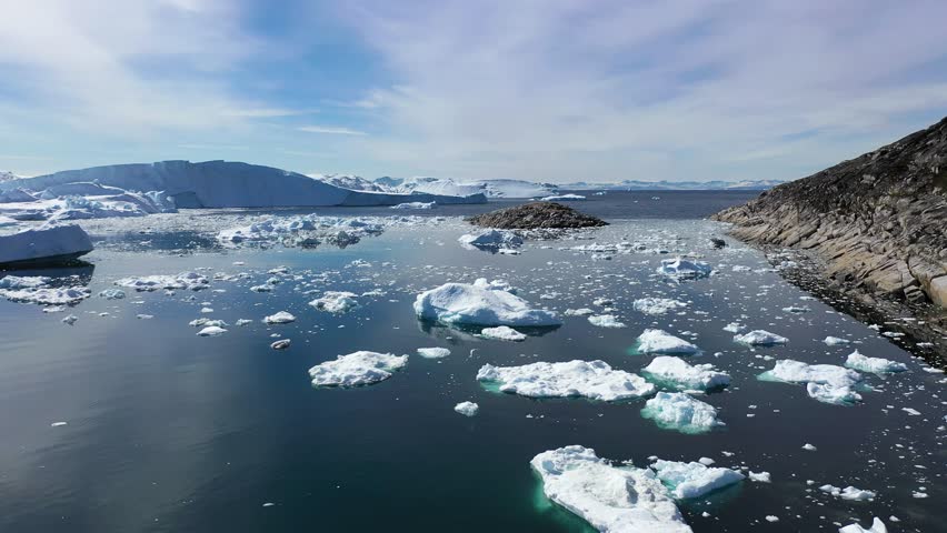 Greenland. Exploring breathtaking glacial landscapes in the Arctic Ocean during bright sunny weather