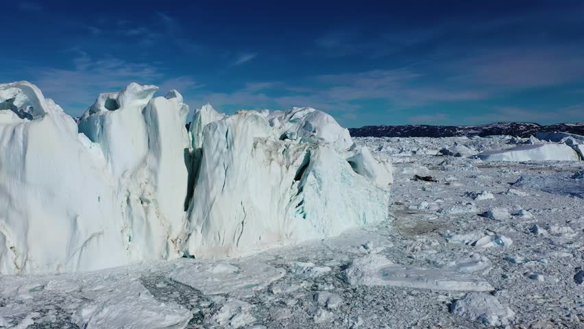 Greenland. Exploring breathtaking glacial landscapes in the Arctic Ocean during bright sunny weather
