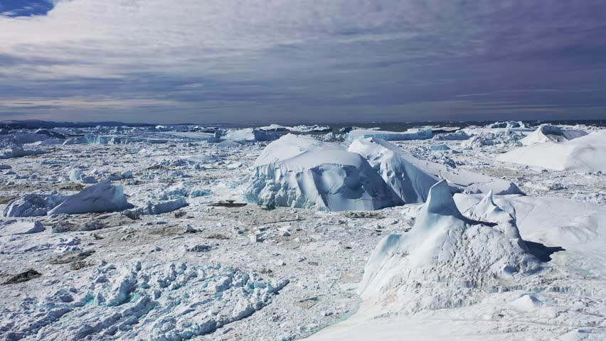 Greenland. Exploring breathtaking glacial landscapes in the Arctic Ocean during bright sunny weather
