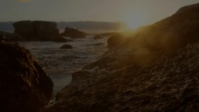 Animation of financial data graphs overlaying rocky coastal landscape at sunset. Finance, stock market, investment, analytics, nature, tranquility - Powered by Shutterstock - Get 15% off with code: PIKWIZARD15