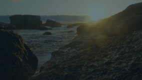 Ocean at sunset with digital network animation overlaying rocky coastline. Technology, connectivity, nature, innovation, sea, landscape - Powered by Shutterstock - Get 15% off with code: PIKWIZARD15