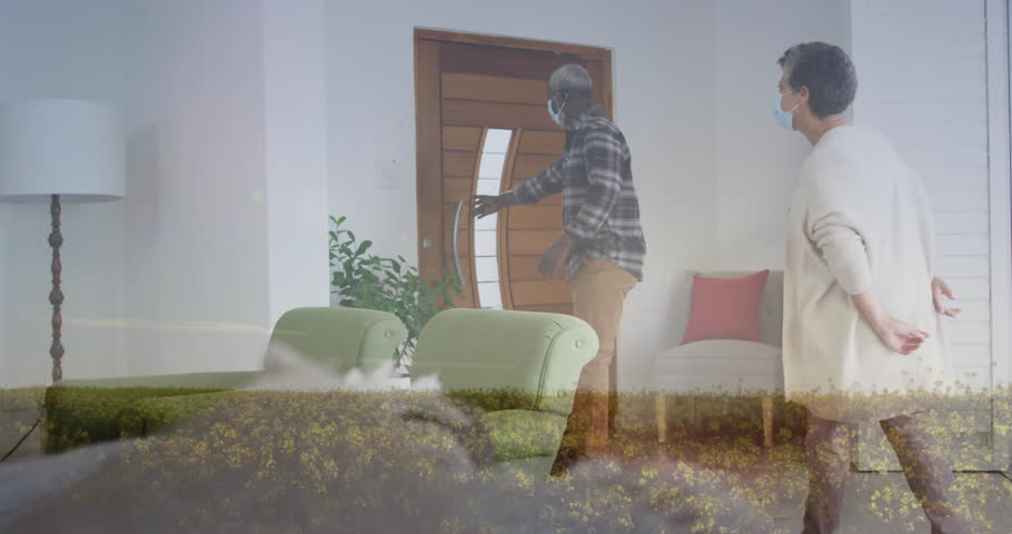 Welcoming visitors, elderly couple holding flowers with blooming animation overlay. Hospitality, celebration, anniversary, romance, greeting, florals