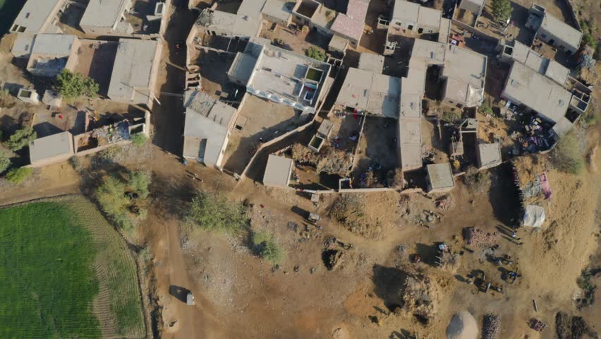 Aerial top shot of roofs of rural houses in a village near Sukkur Sindh, Pakistan.