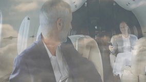 Businessmen using smartphones on private jet with cloud animation overlay. Luxury, travel, technology, aviation, business travel, networking - Powered by Shutterstock - Get 15% off with code: PIKWIZARD15