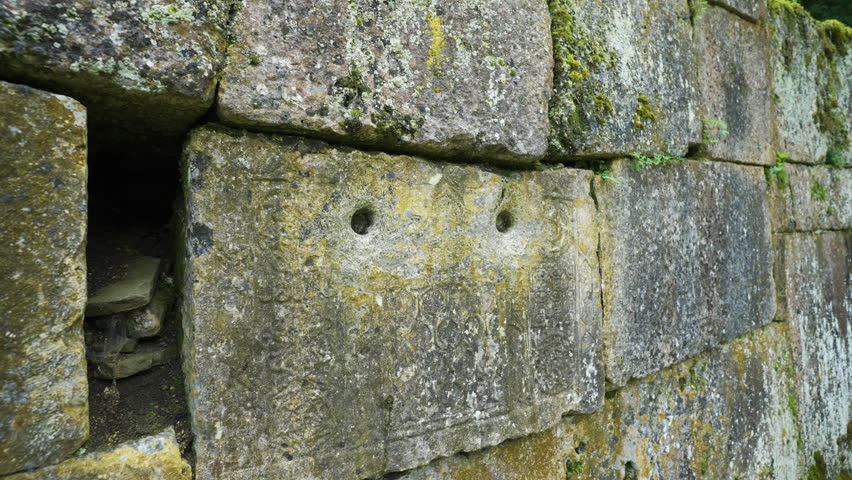 Panning from the left to right and back, showing some ancient designs on the wall of the religious site of the Alevian saint Demir Baba Teke, located in the province of Razgrad in Bulgaria.