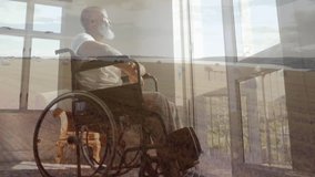 Man in wheelchair thoughtfully gazing outside, watching animation on laptop screen. Disability, technology, contemplation, accessibility, indoors, person - Powered by Shutterstock - Get 15% off with code: PIKWIZARD15