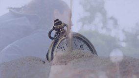 Partially buried in sand, antique pocket watch with blurred background. vintage, timepiece, nostalgia, treasure, discovery - Powered by Shutterstock - Get 15% off with code: PIKWIZARD15