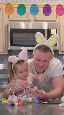 Enjoying Easter Egg Decorating Fun Together with Dad and Daughter This Special Holiday
