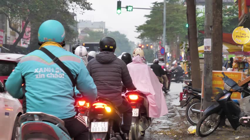Hanoi , Vietnam - 04 01 2025: Downtown Hanoi with motorbikes and scooters in heavy traffic. New traffic rules since 2025, Vietnam