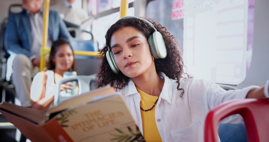 Bus, headphones and woman with book in city for journey, commute and travel in urban town. Public transport, passenger and person reading on vehicle and listening to podcast, audiobook and recording