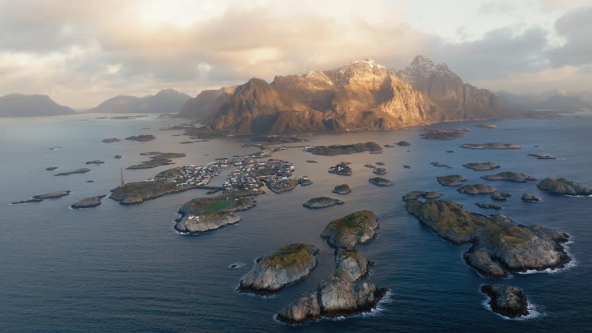 Henningsvaer stadium near Henningsvaer village on Lofoten islands during sunrise, Drone shot, Panorama
