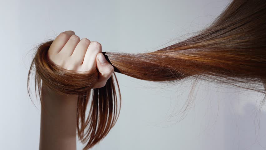 Woman Showcasing Strong, Radiant Hair