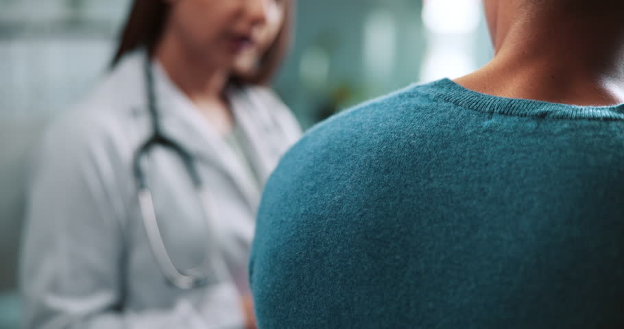 Hands, doctor and comfort patient in hospital with empathy, care or kindness for bad news with healthcare report. People, medic and support with shoulder, advice or discussion for diagnosis at clinic