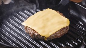 cook remove from hot grill pan fresh ground beef burger meat with cheese slice, food closeup - Powered by Shutterstock - Get 15% off with code: PIKWIZARD15