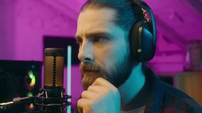 Contemplative Caucasian streamer gamer influencer man guy think contemplate host search solution cyber sport game at home addict blogger idea male raising index finger vlogger smile neon realization - Powered by Shutterstock - Get 15% off with code: PIKWIZARD15