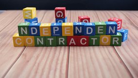 Colorful blocks spell independent contractor on wood, highlighting a playful and creative idea. - Powered by Shutterstock - Get 15% off with code: PIKWIZARD15