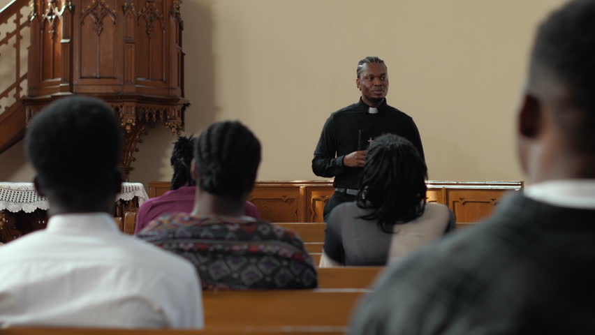 Devoted spiritual leader guiding diverse congregation in heartfelt prayer within sacred church interior, embodying faith and community unity