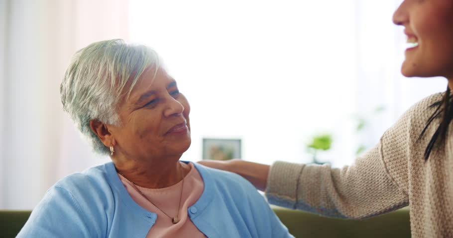 Hug, old woman and girl in living room, smile and care for granddaughter in house, joy and happy. Apartment, embrace and affection in mothers day, conversation and bonding with grandma, love and home