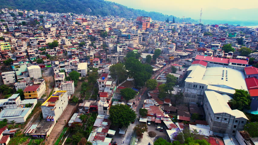 Aerial View of Santiago Atitlan, Guatemala. Town on Coast of Atitlan Lake, Buildings and Streets