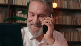 Happy Caucasian old man holding photo frame photography male pensioner talking mobile phone cellphone with family mature senior grandfather smiling indoor office businessman business call communicate - Powered by Shutterstock - Get 15% off with code: PIKWIZARD15