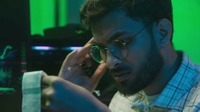 Confused stressed Arabian Indian man checking bill code payment problem trouble computer working trader programmer coder male guy businessman business neon office annoyed IT specialist debt bankruptcy - Powered by Shutterstock - Get 15% off with code: PIKWIZARD15