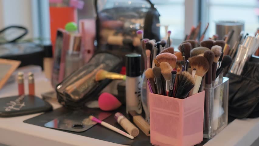 A Variety of Cosmetics Tools Displayed on a Neat Makeup Table for Easy Access and Use