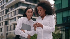 African Asian women females businesswomen business outdoor multiethnic colleagues coworkers holding mobile phone smartphone laughing fun smile chatting social media American Korean girls city friends - Powered by Shutterstock - Get 15% off with code: PIKWIZARD15