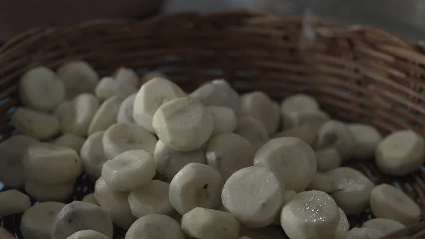 Peeled chestnuts are placed in a basket and are ready to be processed into food.