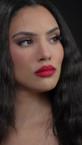 An Elegant and Striking Portrait of a Beautiful Woman Featuring Bold and Complex Makeup
