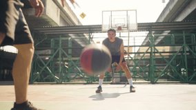 Wellness outdoor sport training street basketball. Two strong sportsman basketball player playing streetball match at outdoor court in the city. Male athlete do fitness workout exercise in sunny day. - Powered by Shutterstock - Get 15% off with code: PIKWIZARD15