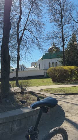 Sunny Park View With a Church and Trees on a Clear Spring Day