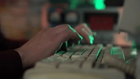 Hands of Man Typing on Keyboard of Old Desktop Computer While LIstening Audio Cassette Tape Recording - Powered by Shutterstock - Get 15% off with code: PIKWIZARD15