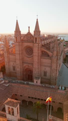 The Cathedral of Santa Maria of Palm, Palma de Mallorca, Mallorca, Balearic Islands, Spain. Aerial view of the Columbarios La Seu in Majorca at sunrise. 