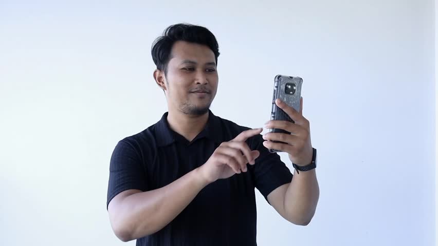 Asian Guy making a videocall with the loved one.