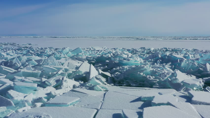 Aerial view of huge ridge of ice hummocks on Lake Baikal, Russia, 4k