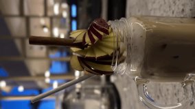 Two coffee drinks on a rustic wooden table. One is with latte art, the other is an iced latte with ice cubes. Two Cups of Coffee on a Wooden Table, Latte and Iced Latte - Powered by Shutterstock - Get 15% off with code: PIKWIZARD15