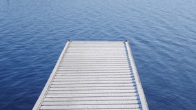 Snow covered pier or wooden dock blue eater moving in a tranquil winter setting. Slow motion  - Powered by Shutterstock - Get 15% off with code: PIKWIZARD15