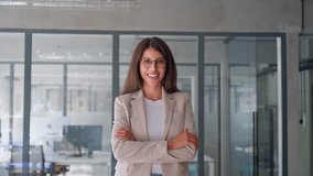 Friendly ceo leader smiling latin hispanic, middle eastern business woman standing in office looking at camera. Portrait of middle age manager specialist entrepreneur and businesswoman at workplace - Powered by Shutterstock - Get 15% off with code: PIKWIZARD15