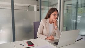 Focused middle aged business woman using laptop at work in office. Professional female executive entrepreneur in suit working on computer pc at company workplace, doing financial analyze. Copy space - Powered by Shutterstock - Get 15% off with code: PIKWIZARD15