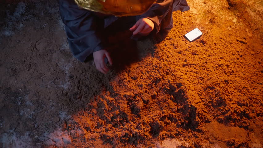 Mysterious Mage Unveiling Glowing Treasure Chest