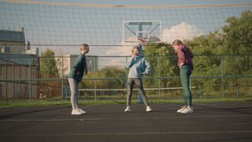 Sporty women in activewear performing waist twist exercises outdoors in a sport arena, a vibrant and energetic scene featuring athletic movements with a volleyball court in the background - Powered by Shutterstock - Get 15% off with code: PIKWIZARD15