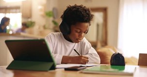 Black kid, tablet or writing with headphones for elearning, virtual classroom or online lesson at home. African, boy or student on technology or book for remote learning, education or homeschooling - Powered by Shutterstock - Get 15% off with code: PIKWIZARD15