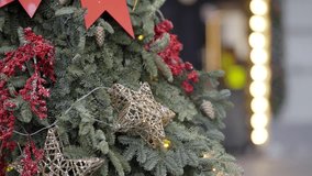 Christmas tree decorated with golden stars and red ornaments. Action - Powered by Shutterstock - Get 15% off with code: PIKWIZARD15