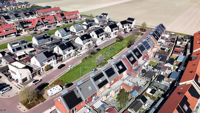 Experience the charm of Dutch suburban life in a contemporary residential area featuring modern family houses equipped with solar panels.