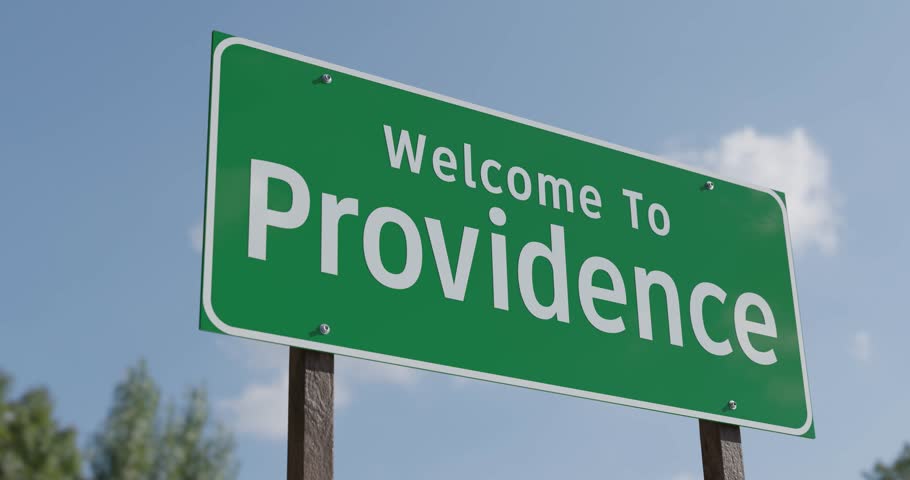 Driving By A Welcome To Providence, Rhode Island Green Road Sign Against a Blue Sky and Clouds - United States Capital Series.