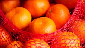 Customer choosing tangerines in slow motion - Powered by Shutterstock - Get 15% off with code: PIKWIZARD15